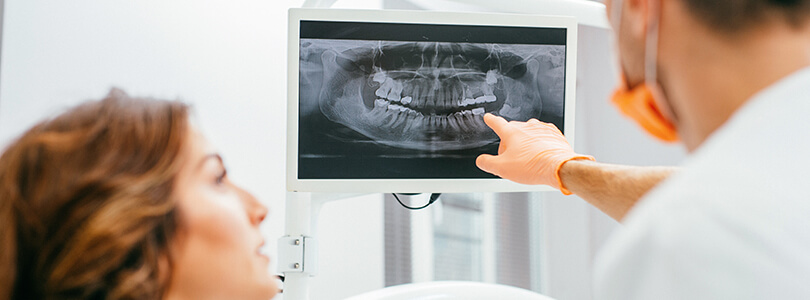 dentist explaining x-rays to patient