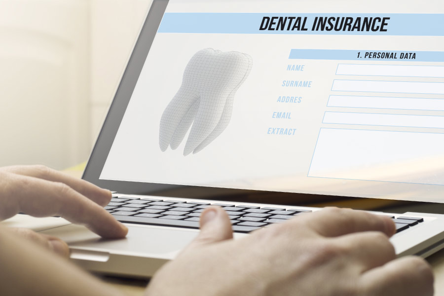 laptop computer screen reviewing dental insurance