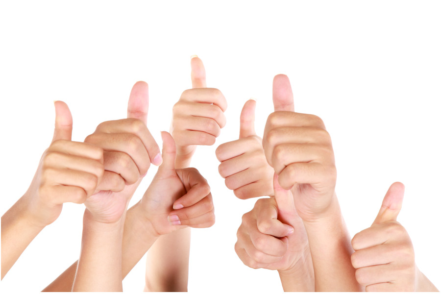 six thumbs up in the air for great dental care